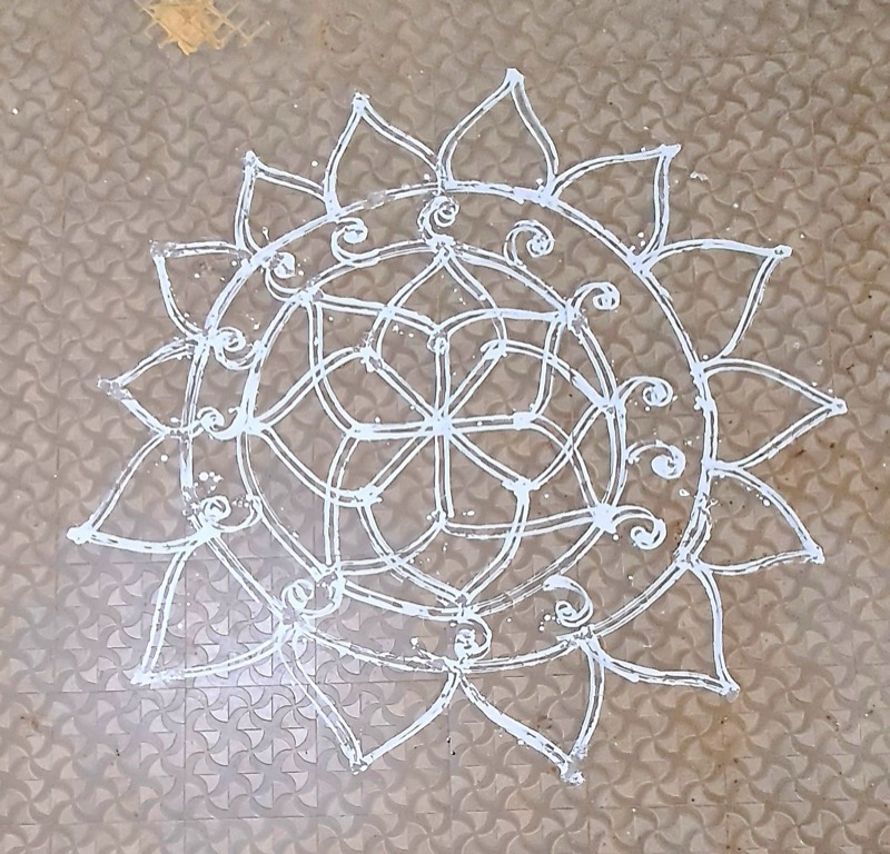 A kolam drawn on the floor