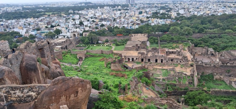 Ruins of a hilltop fort above a city